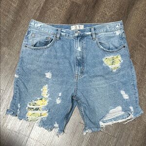 Distressed tropical patched denim shorts
